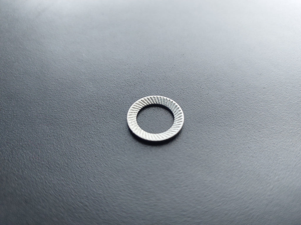 Lock washer, galvanised, outer ø 16 mm, inner ø 10.5 mm.