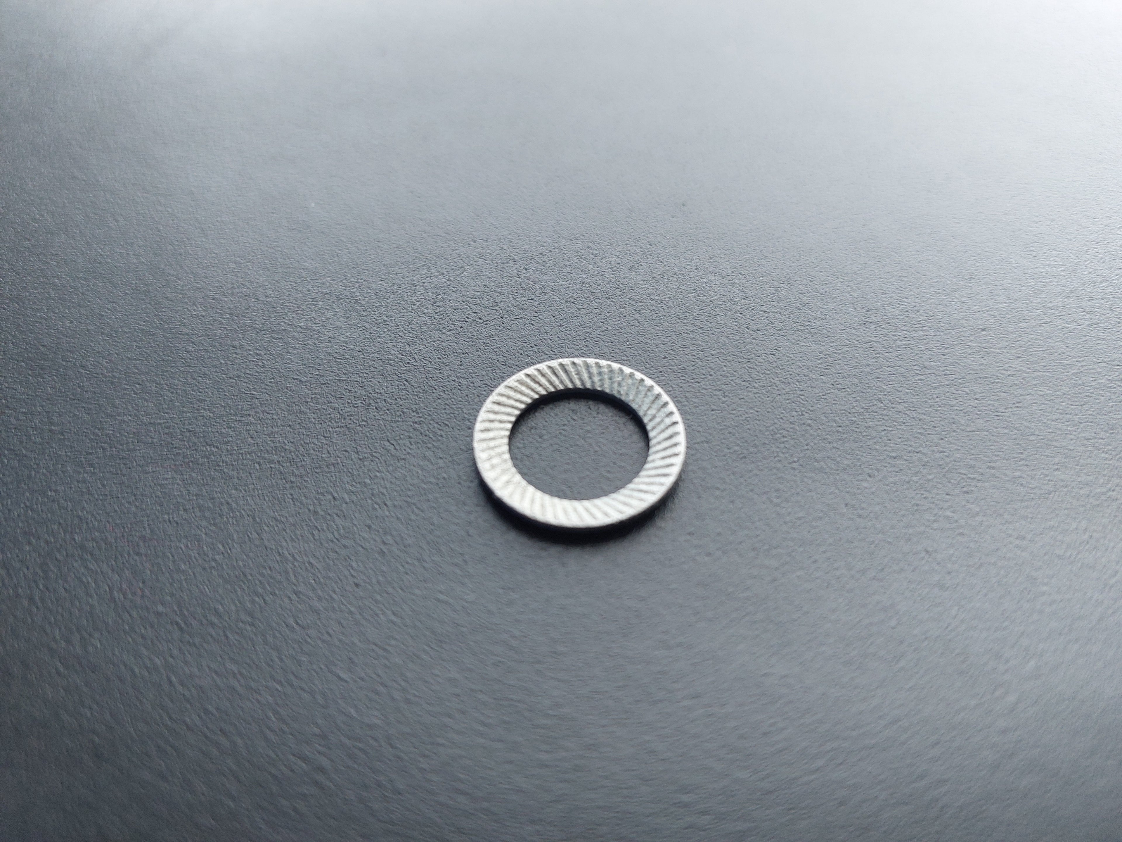 Lock washer, galvanised, outer ø 16 mm, inner ø 10.5 mm.