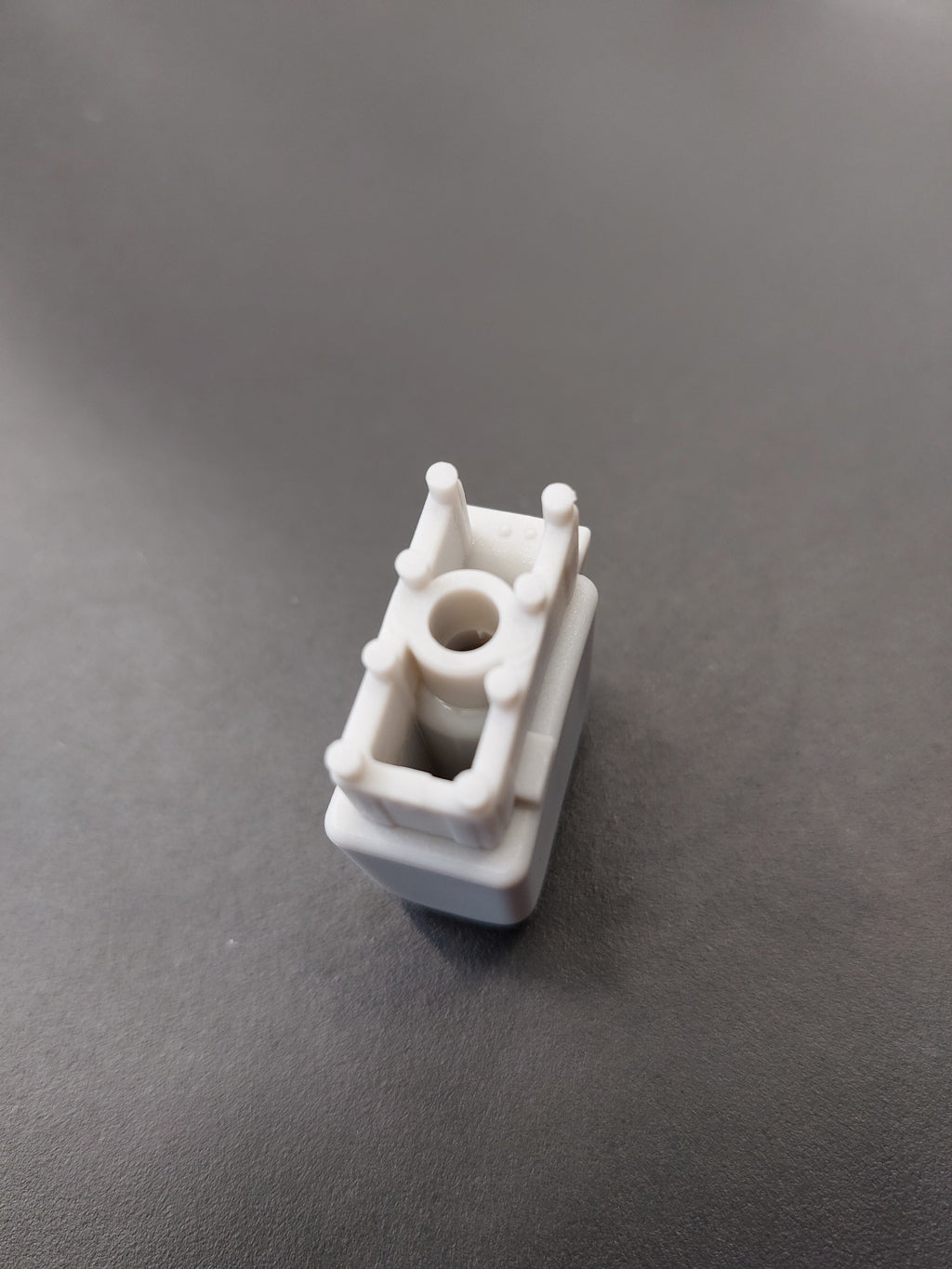 End cap, on telescopic shaft for end of spoke, long version, fixation with screw, (since 2018), glass fibre reinvorced plastic, grey, for frame in RAL 9006, 30 x 15 mm, length 32 mm, for SCHATTELLO.