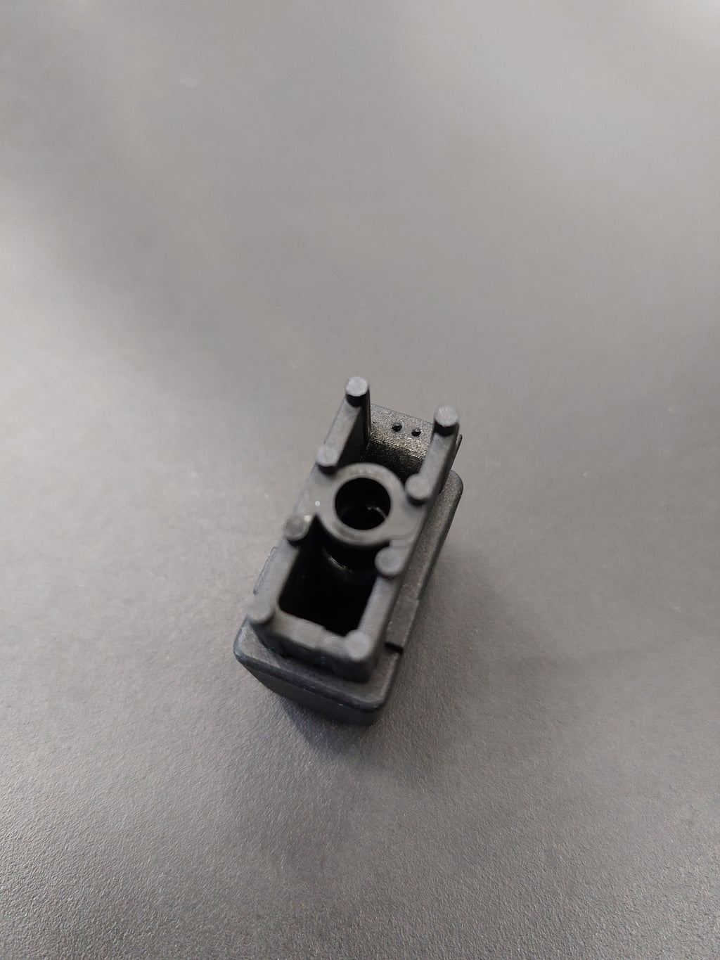 End cap, on telescopic shaft for end of spoke, long version, fixation with screw, (since 2018), glass fibre reinvorced plastic, black, for frame in RAL 8019 and 7016, 30 x 15 mm, length 32 mm, for SCHATTELLO.
